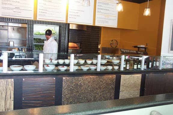 Solid-surface food display at Ingredient Restaurant in Lawrence, Kansas